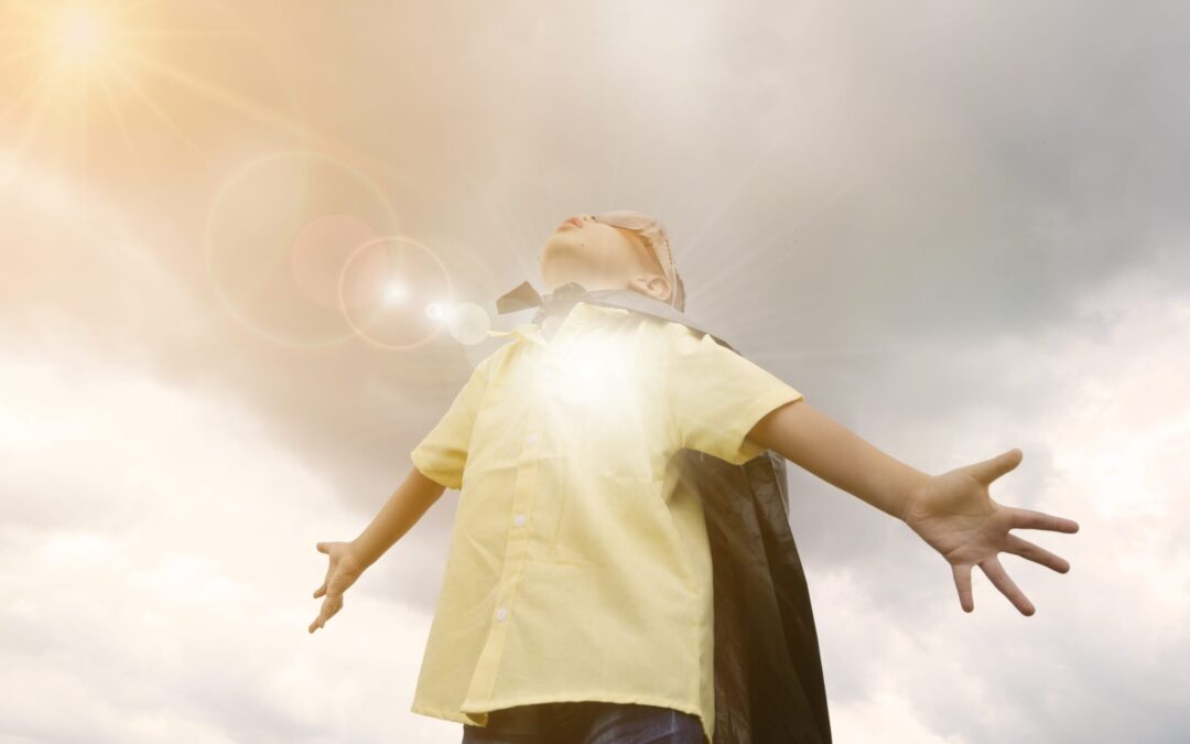 happy kid play superhero , boy power concept
