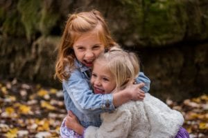 sisters hugging each other