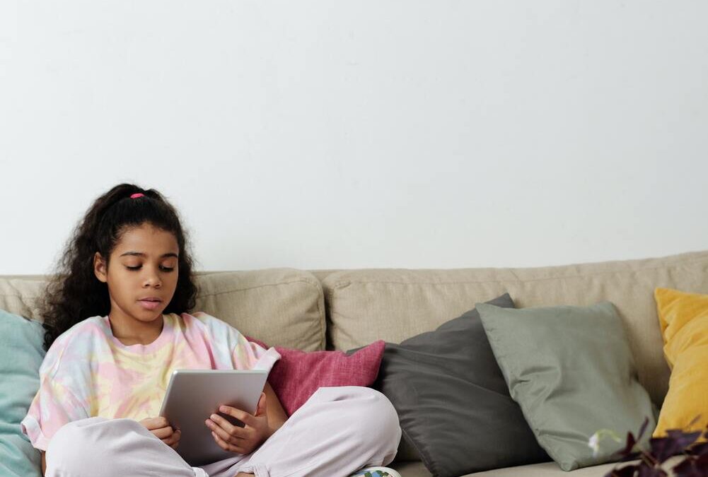 photo-of-girl-sitting-on-sofa-wh