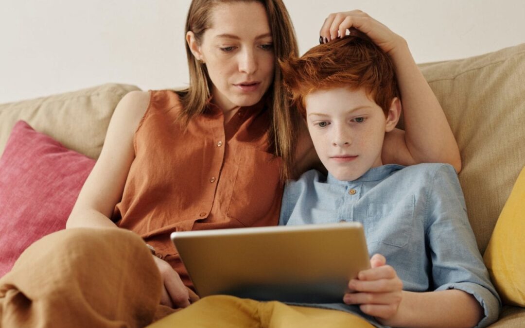 photo-of-woman-and-boy-watching-through-tablet-computer-4145349