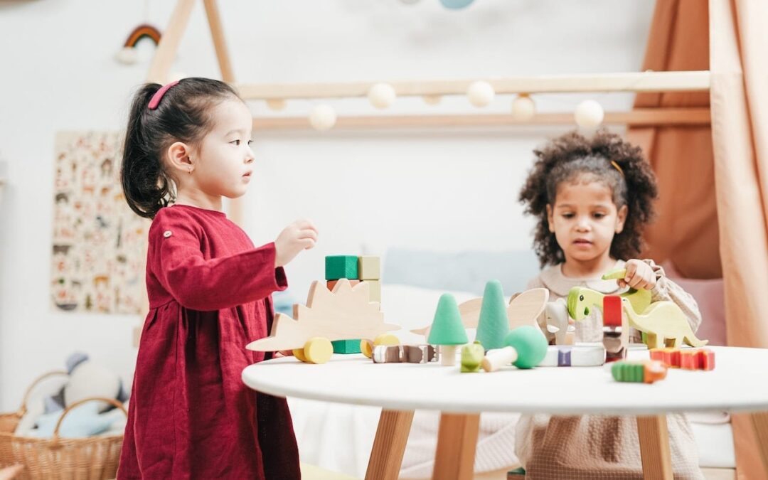 two-children-playing-a-wooden-toys-3662666