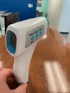 hand holding a No Touch Forehead Thermometer