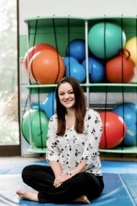 Patient Relation Coordinator Carolyn sitting in the sensory gym