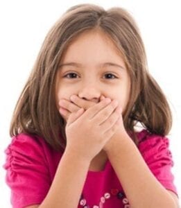 Young girl covering her mouth