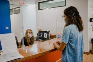 Receptionist greeting a guest