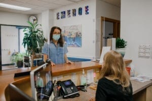 Receptionist greeting a guest