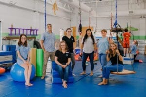 Emerge Pediatric Therapy Staff posing in the Sensory Gym