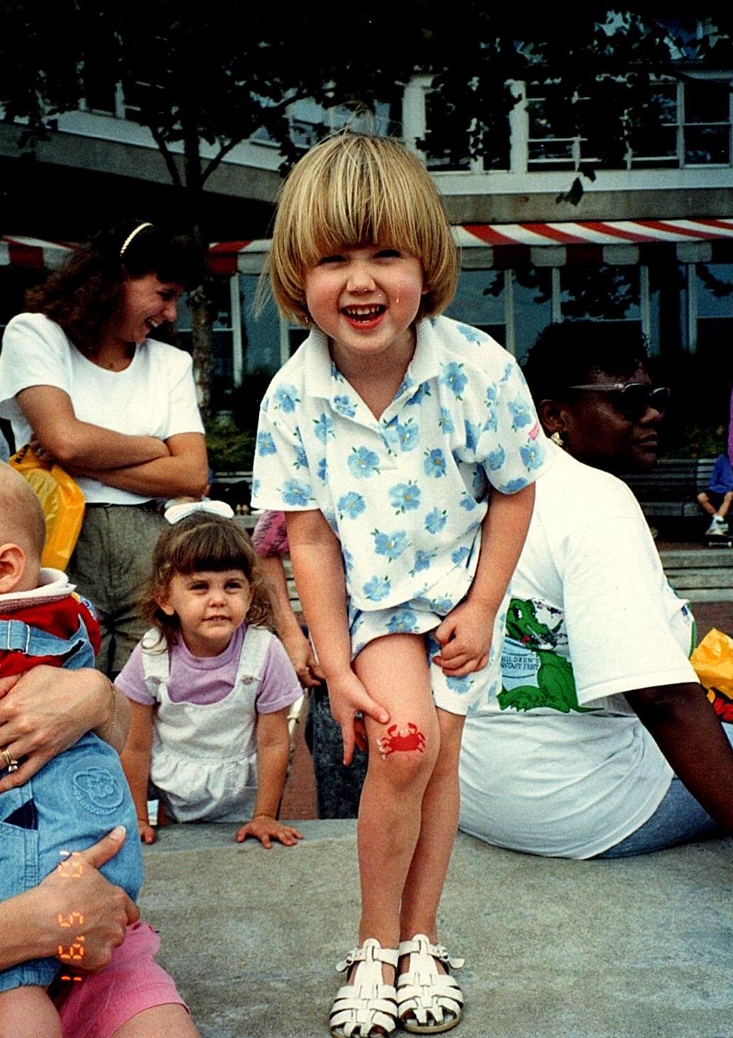 Clinical Director of Occupational Therapy, Occupational Therapist Brooke Brees as a young girl wearing a white polo with blue patterns
