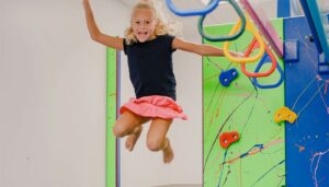 Photo of a little girl jumping on a trampoline