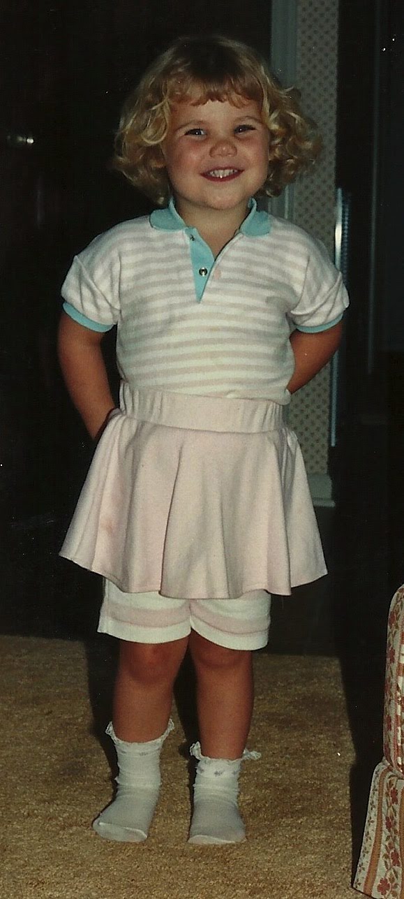 Speech Language Pathologist Anna Housman posing in a ballerina outfit with a dance baton