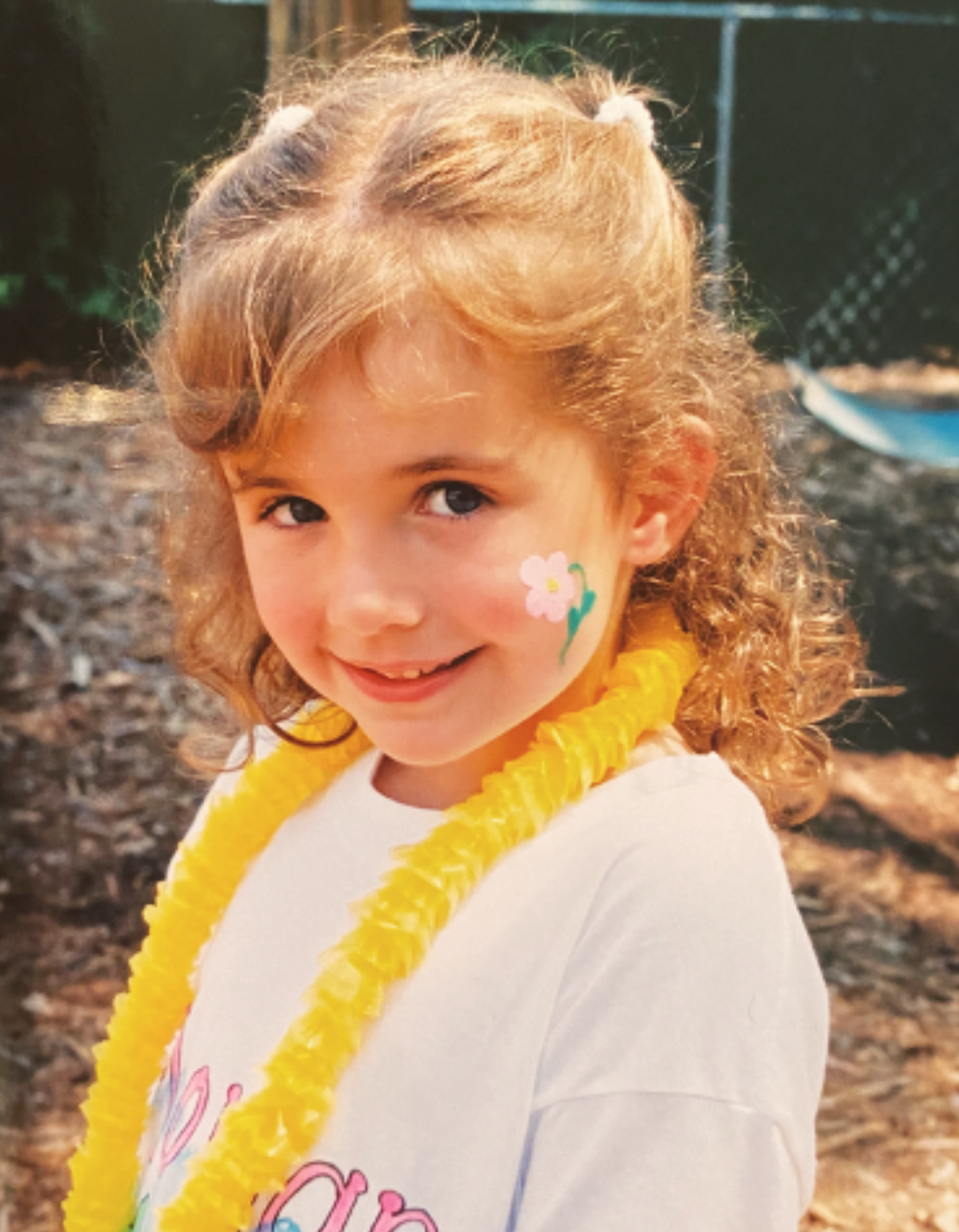 Speech Language Pathologist Anna Housman posing in a ballerina outfit with a dance baton