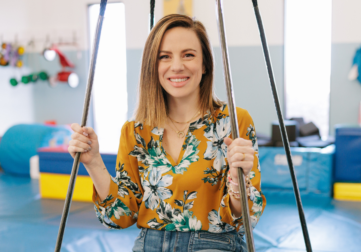 EXECUTIVE DIRECTOR Brittni smiling in the Sensory Gym