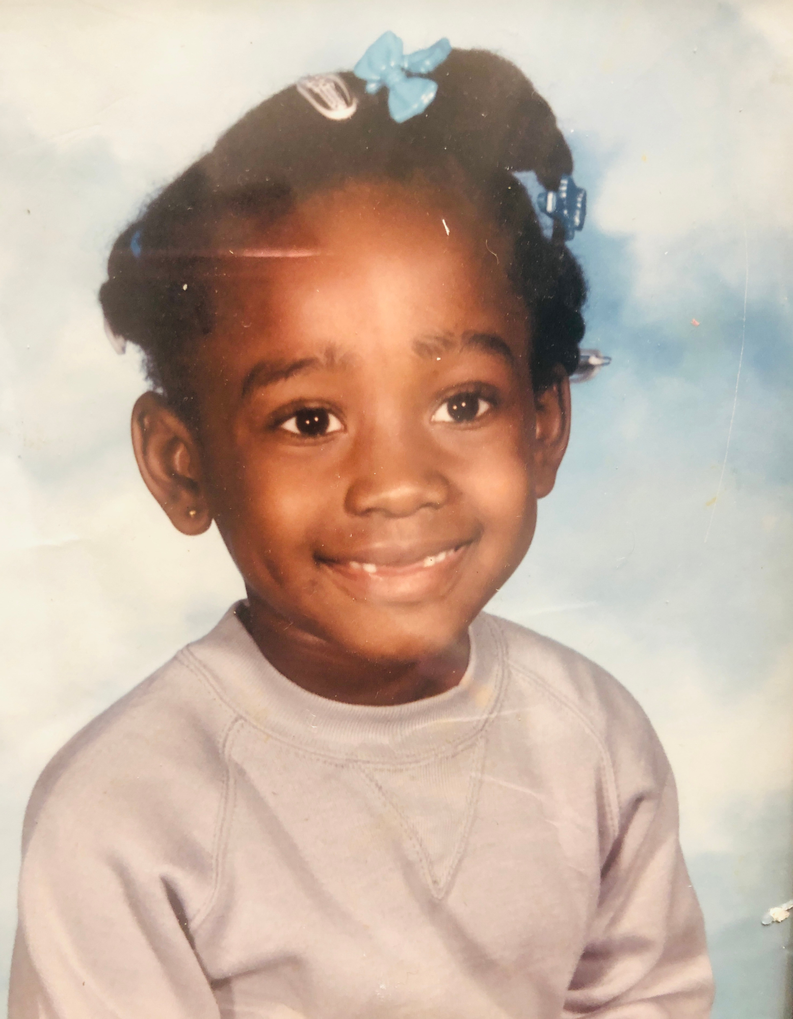 Kayon Lyon-Jones baby pic Occupational Therapist Andrew Klein as a young boy sitting at a table with a workbook