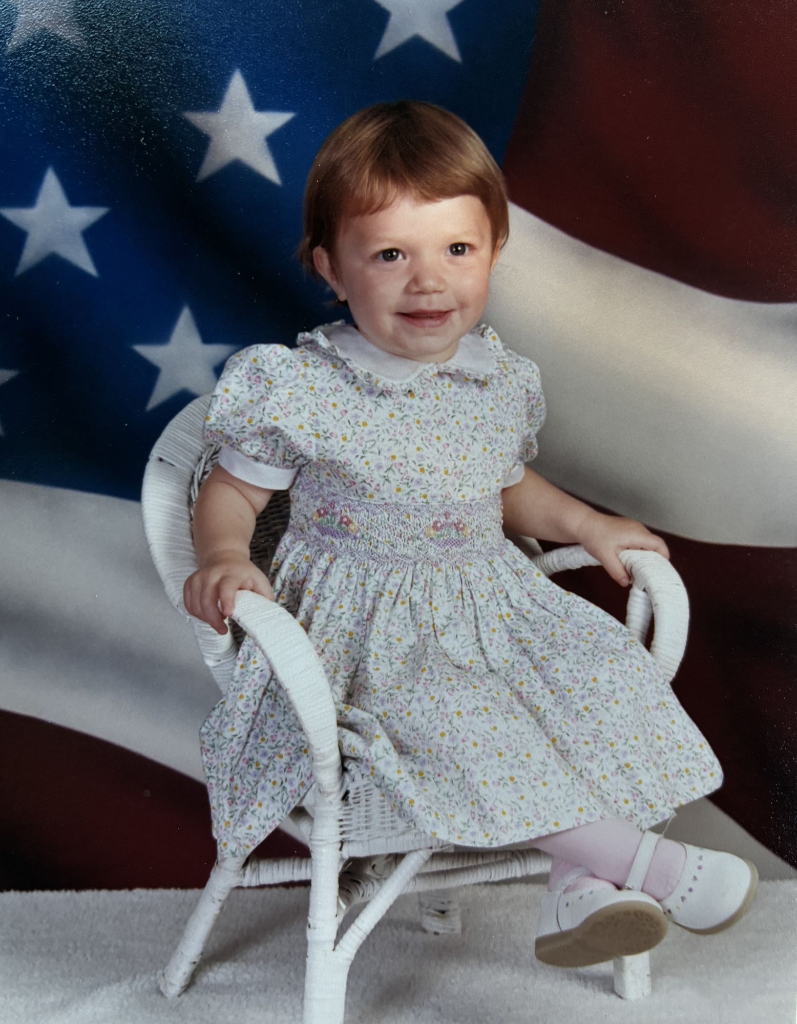 Speech Language Pathologist Laura Strenk as a girl, wearing a purple sweater with toy jewelry