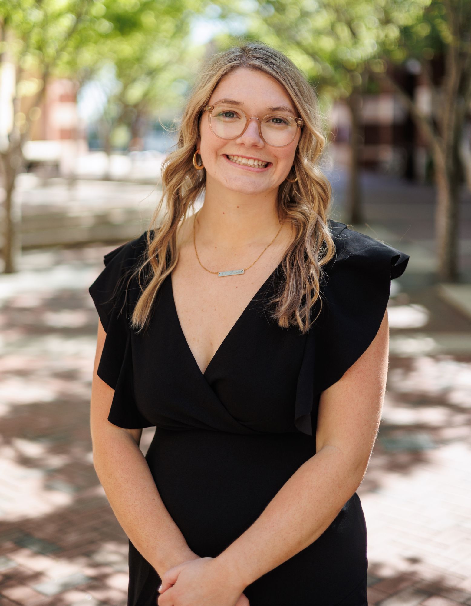 Speech Language Pathologist Laura sitting in sensory gym