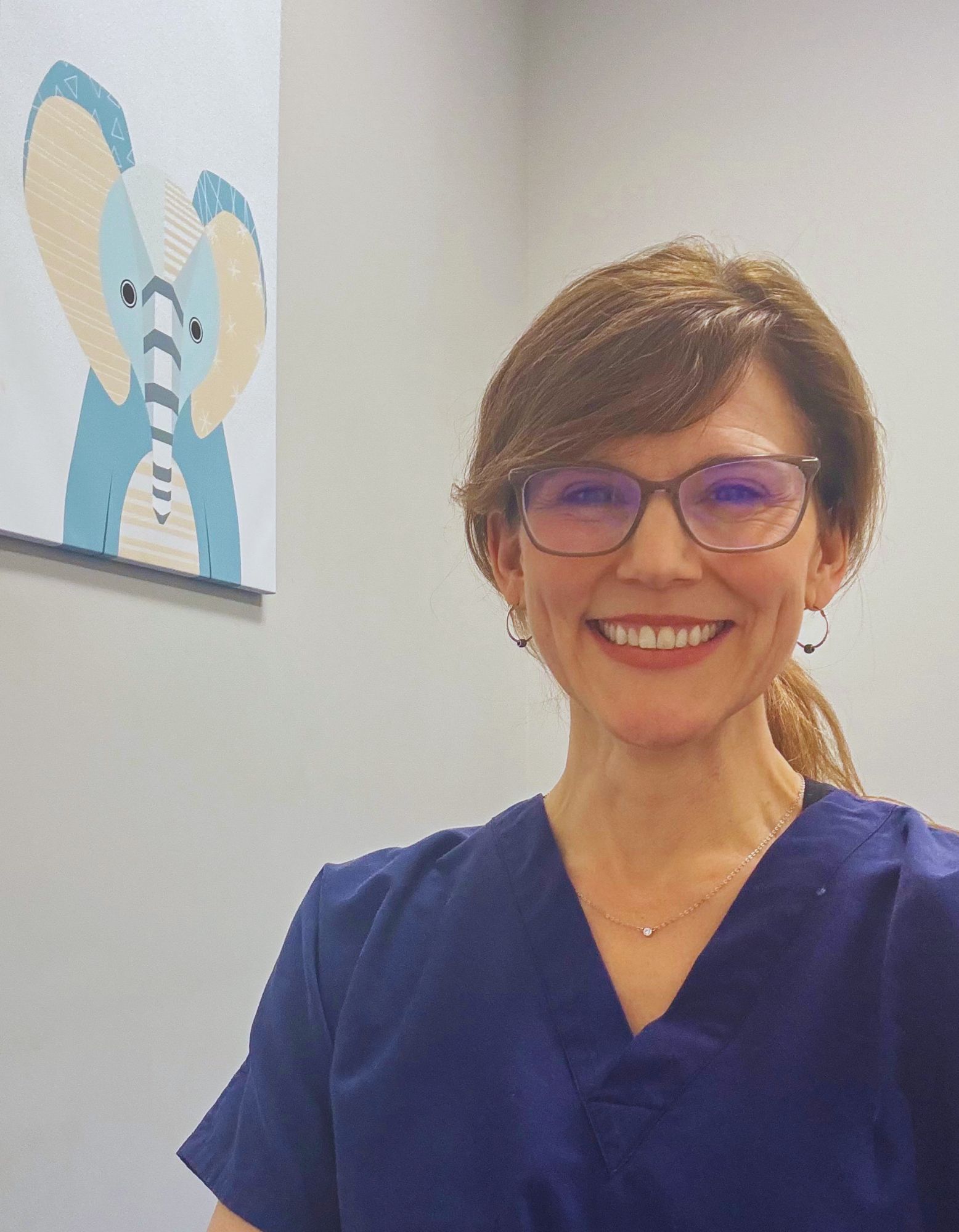 Occupational Therapist Andrew Klein inside a tunnel swing in the sensory gym