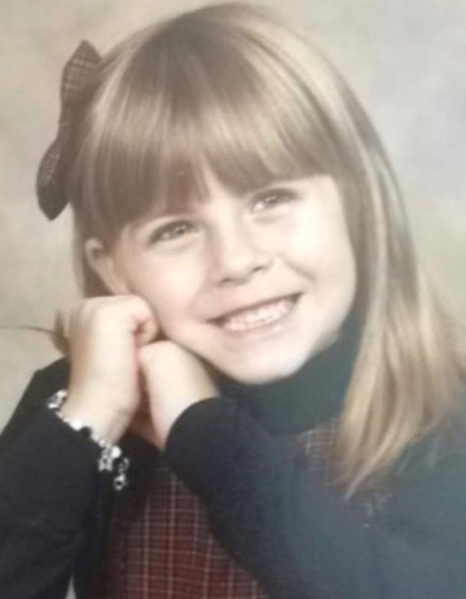 Speech Language Pathologist Anna Housman posing in a ballerina outfit with a dance baton