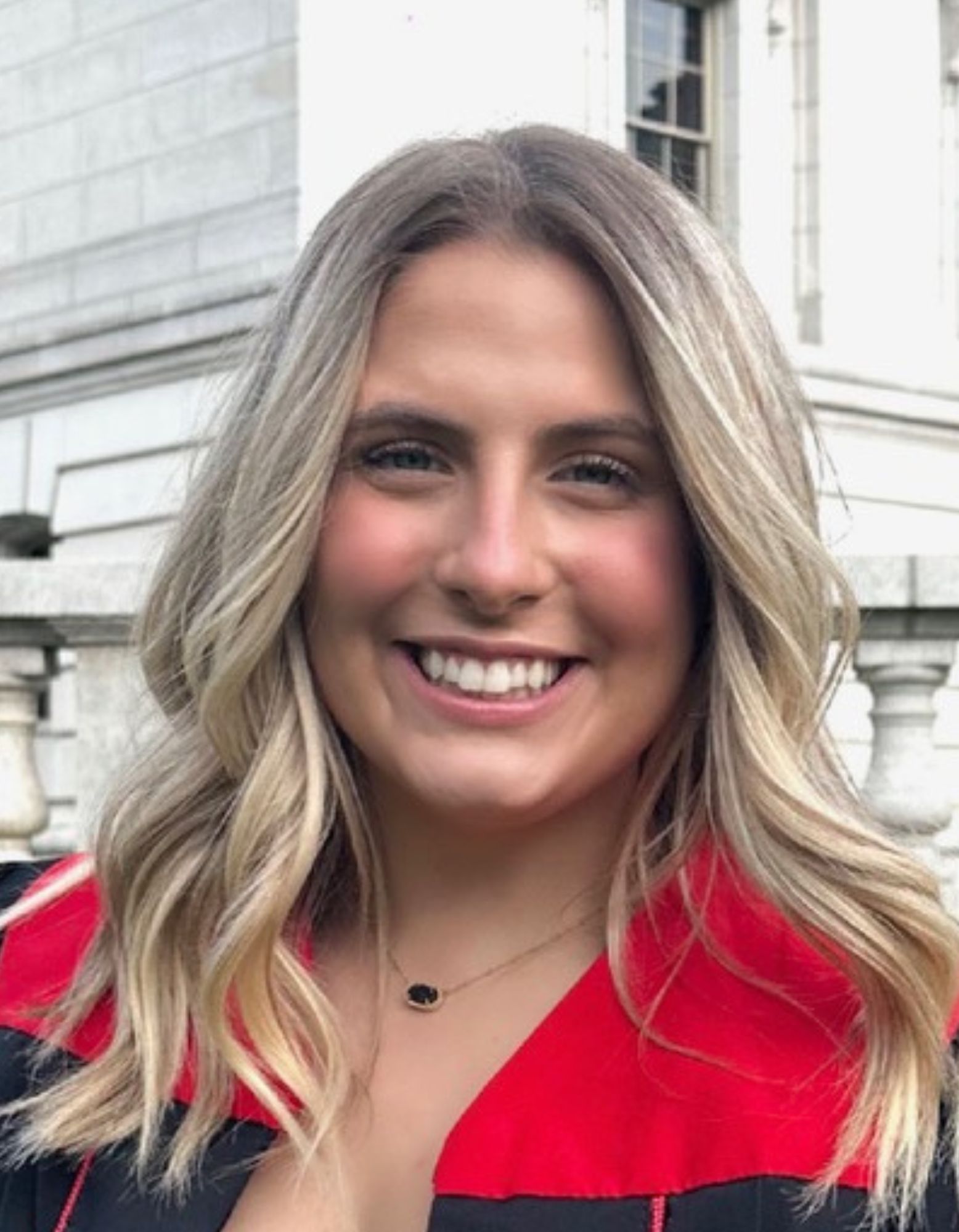 EXECUTIVE DIRECTOR Brittni smiling in the Sensory Gym